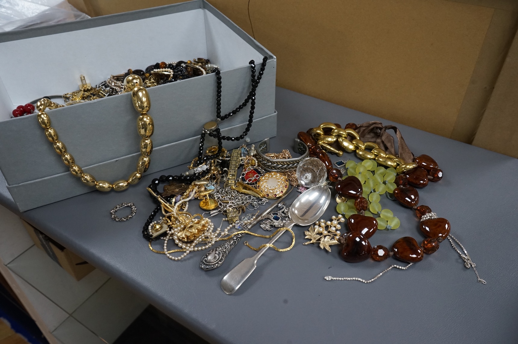 A quantity of assorted recent costume jewellery and two silver handled button hooks.
